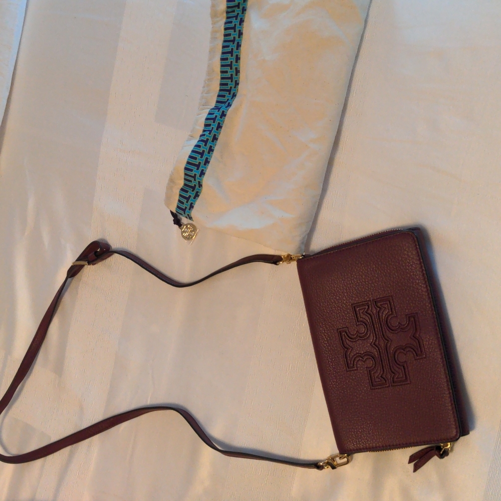Tory Burch crossbody wallet purse in dark maroon color.